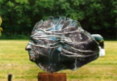 Flowing faces 1999 klei, raku fired